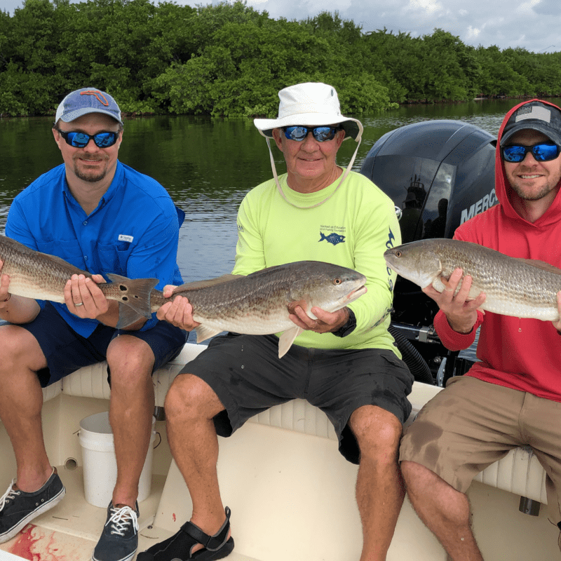 Participants in the 2019 Larry Wilder Fishing Tournament show off their catches