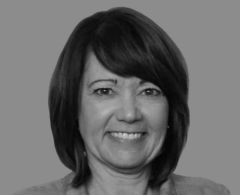 Kim Jowell, middle-aged woman with brown short hair, black and white headshot, Hillsborough Education Foundation